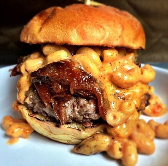 Dirty Bones' 'Mac Daddy' - 6oz house burger topped with pulled beef short rib, mac &amp; cheese and BBQ sauce, served with pickles