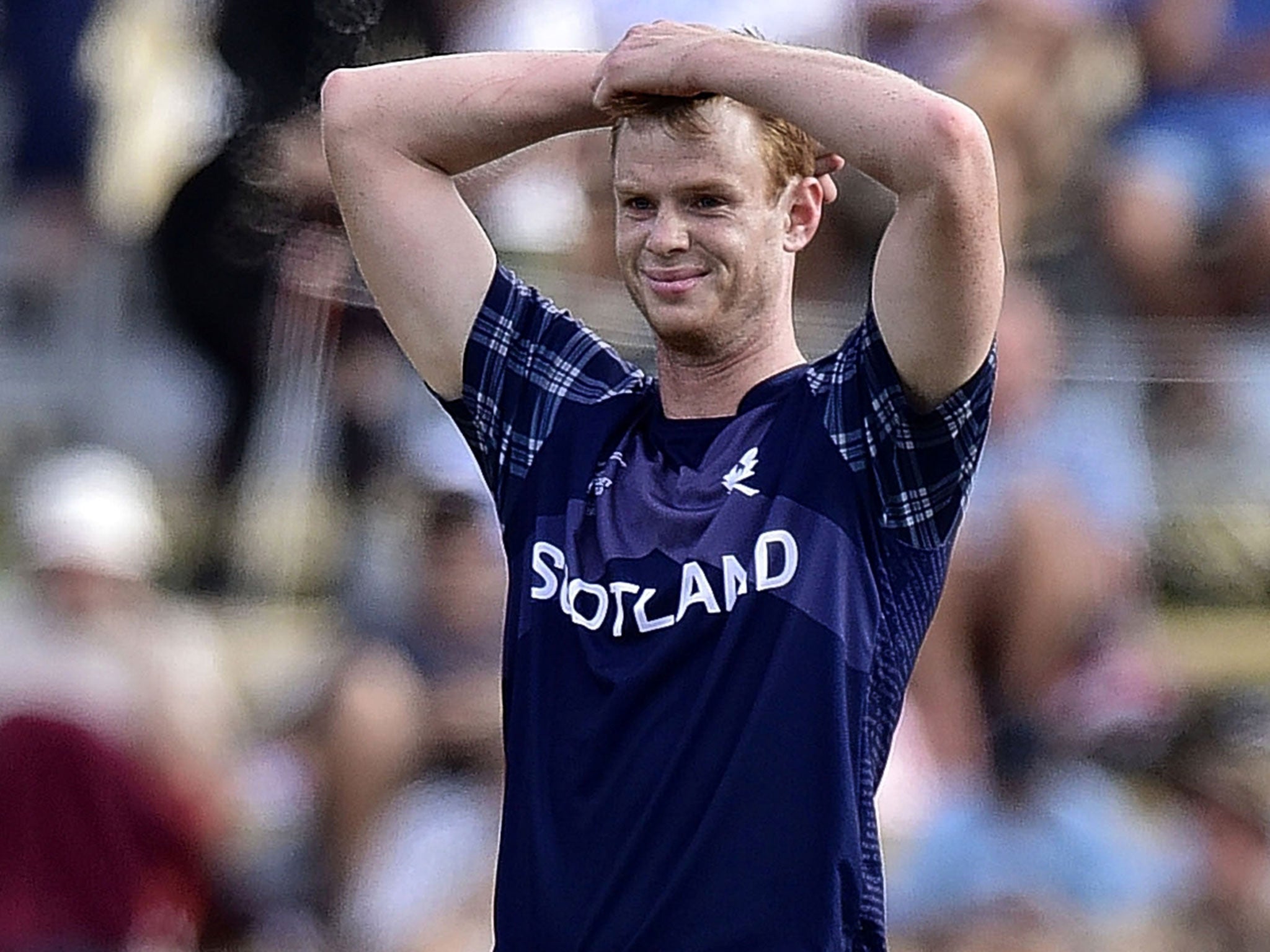 Scotland’s Ali Evans reacts after his team became the first that cannot make the quarter-finals, when they lost by six wickets to Bangladesh