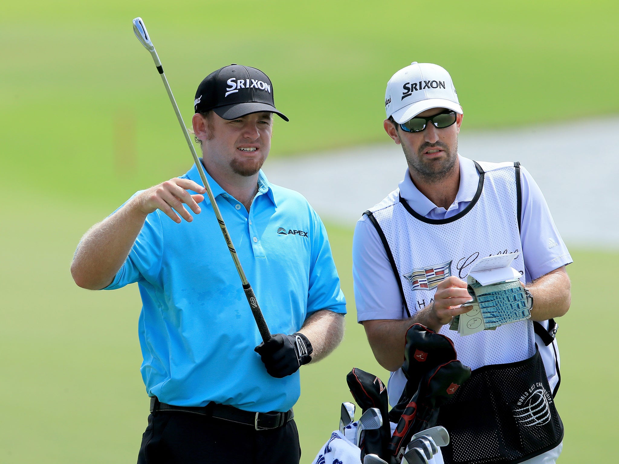 JB Holmes (left) started birdie, birdie, eagle and was six under at the turn