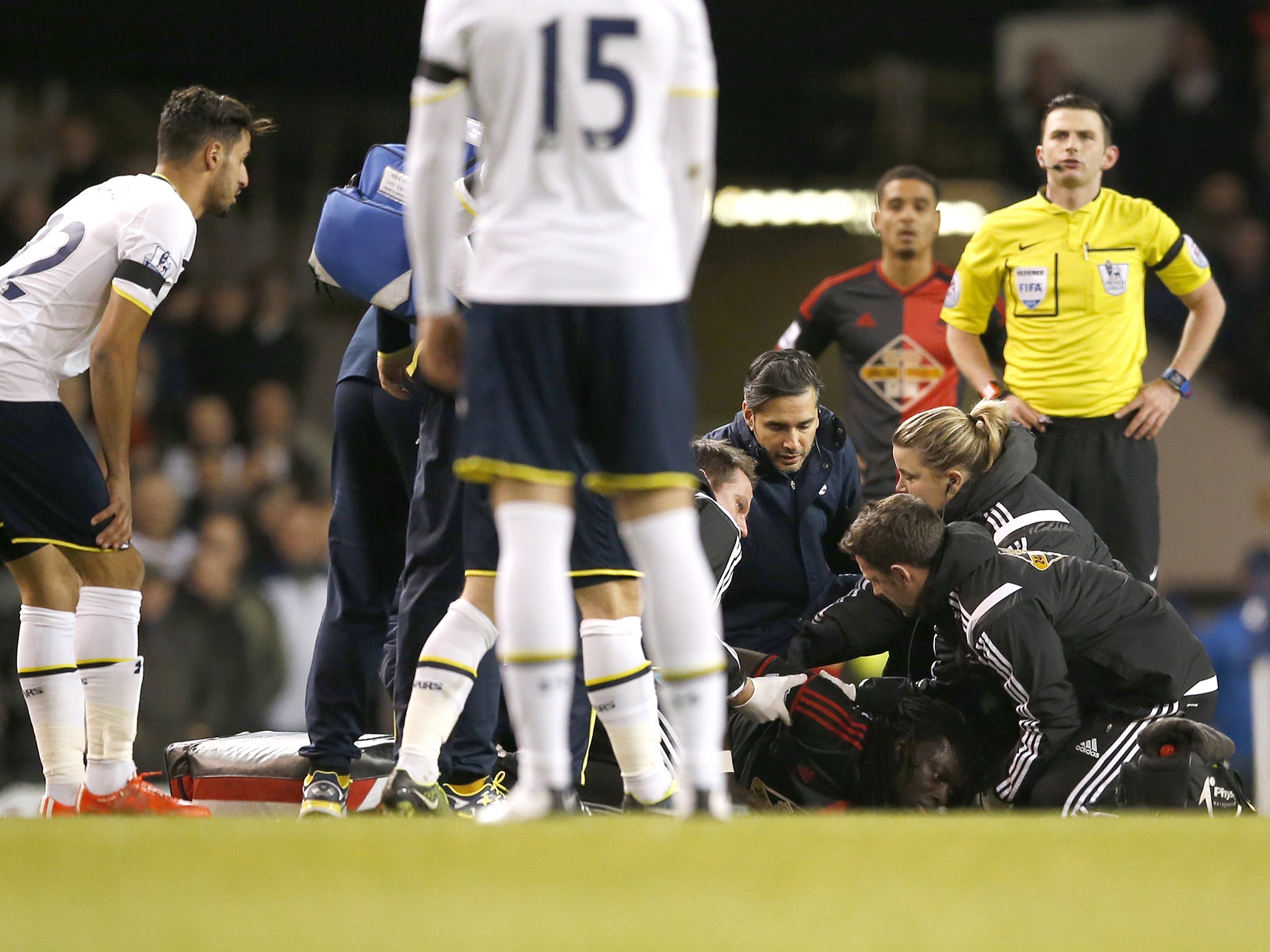 Swansea’s Bafetimbi Gomis collapses after five minutes at White Hart Lane