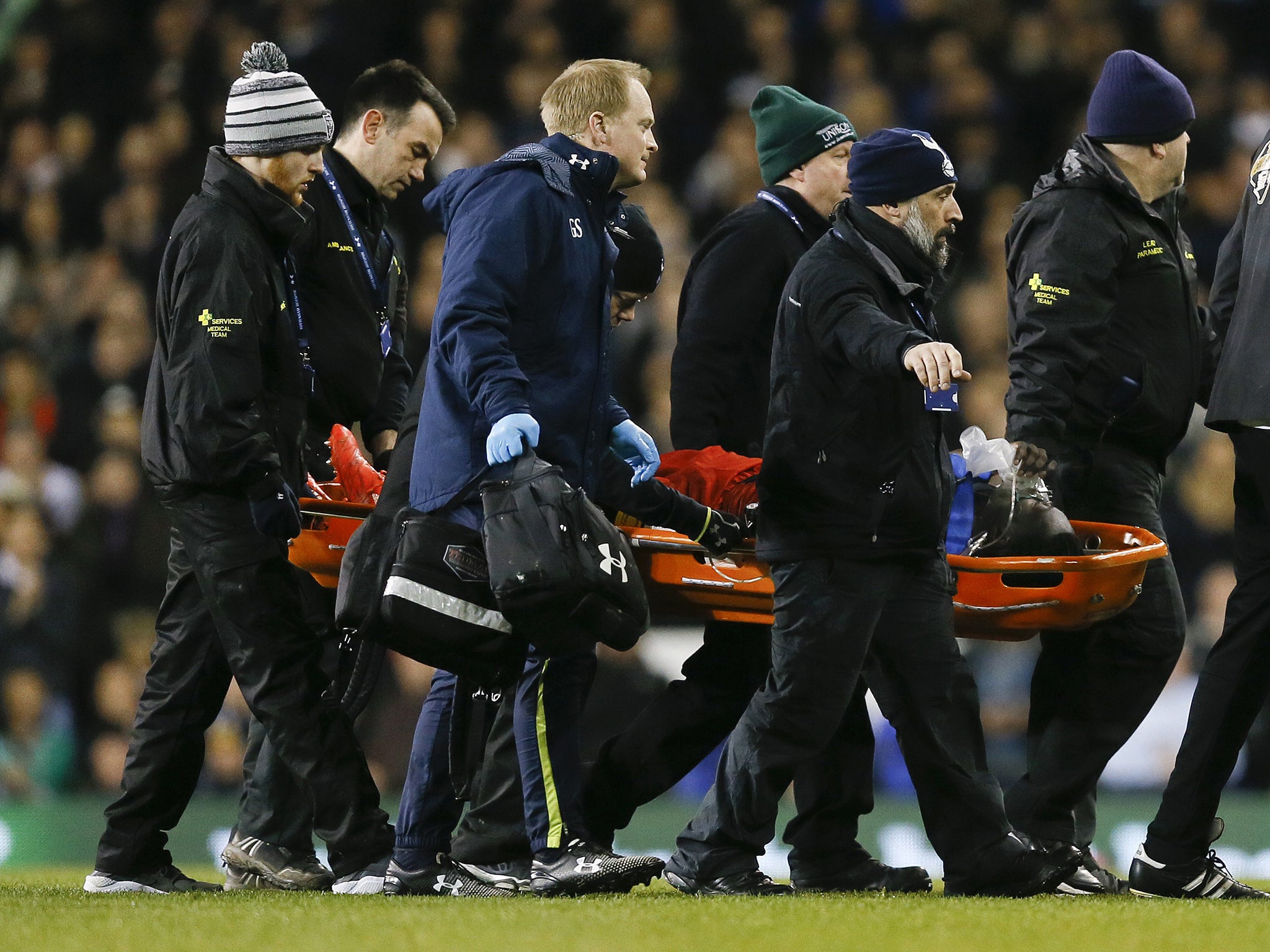 Swansea's Bafetimbi Gomis is carried off the pitch on a stretcher