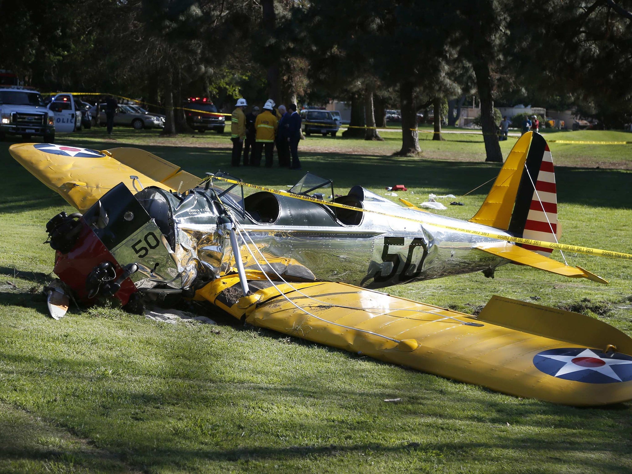 An airplane sits after crash landing at Penmar Golf Course in Venice California