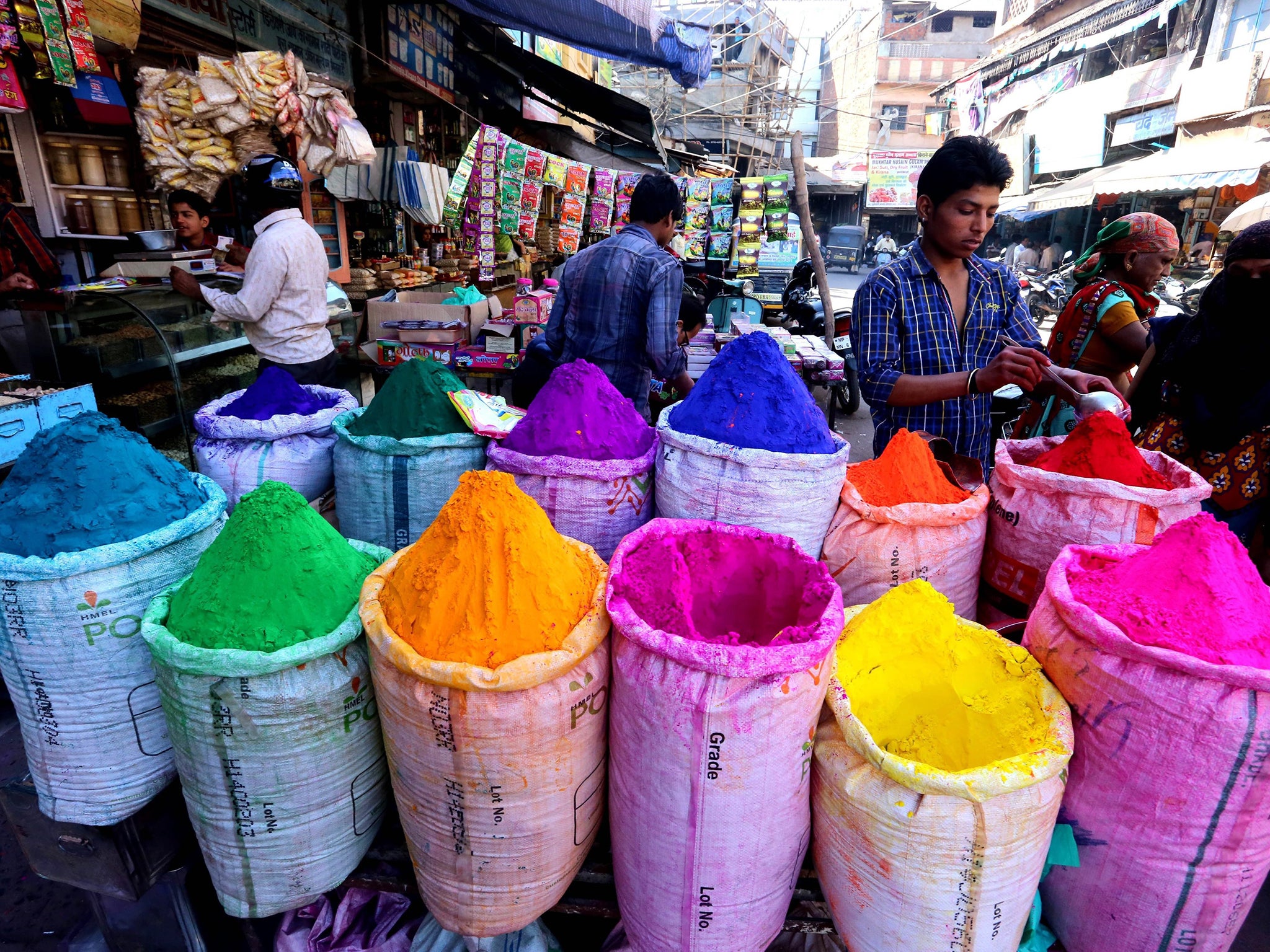 Powdered colors are displayed for sale at a market ahead of the Holi festival in Bhopal, India