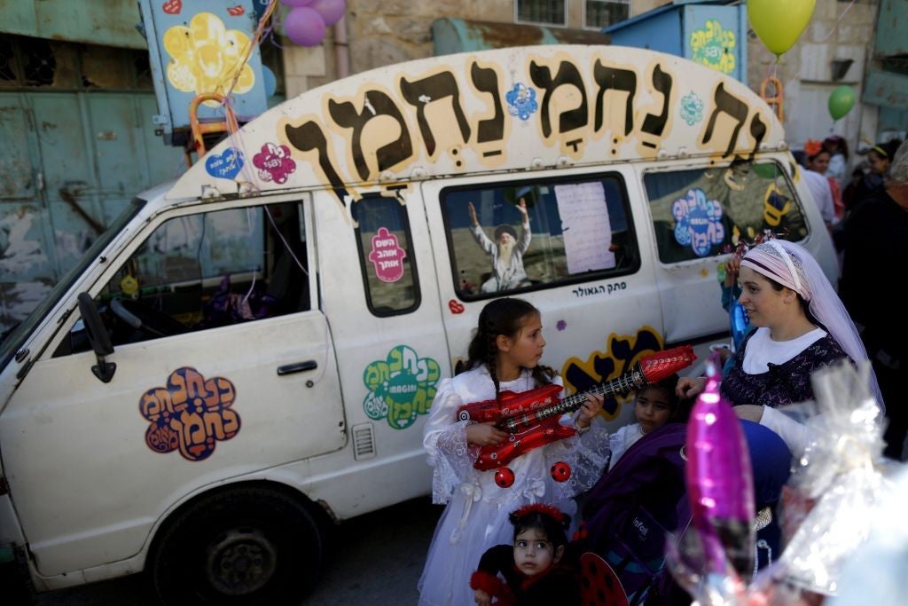 Jewish settlers celebrate in the West Bank city of Hebron in Palestine