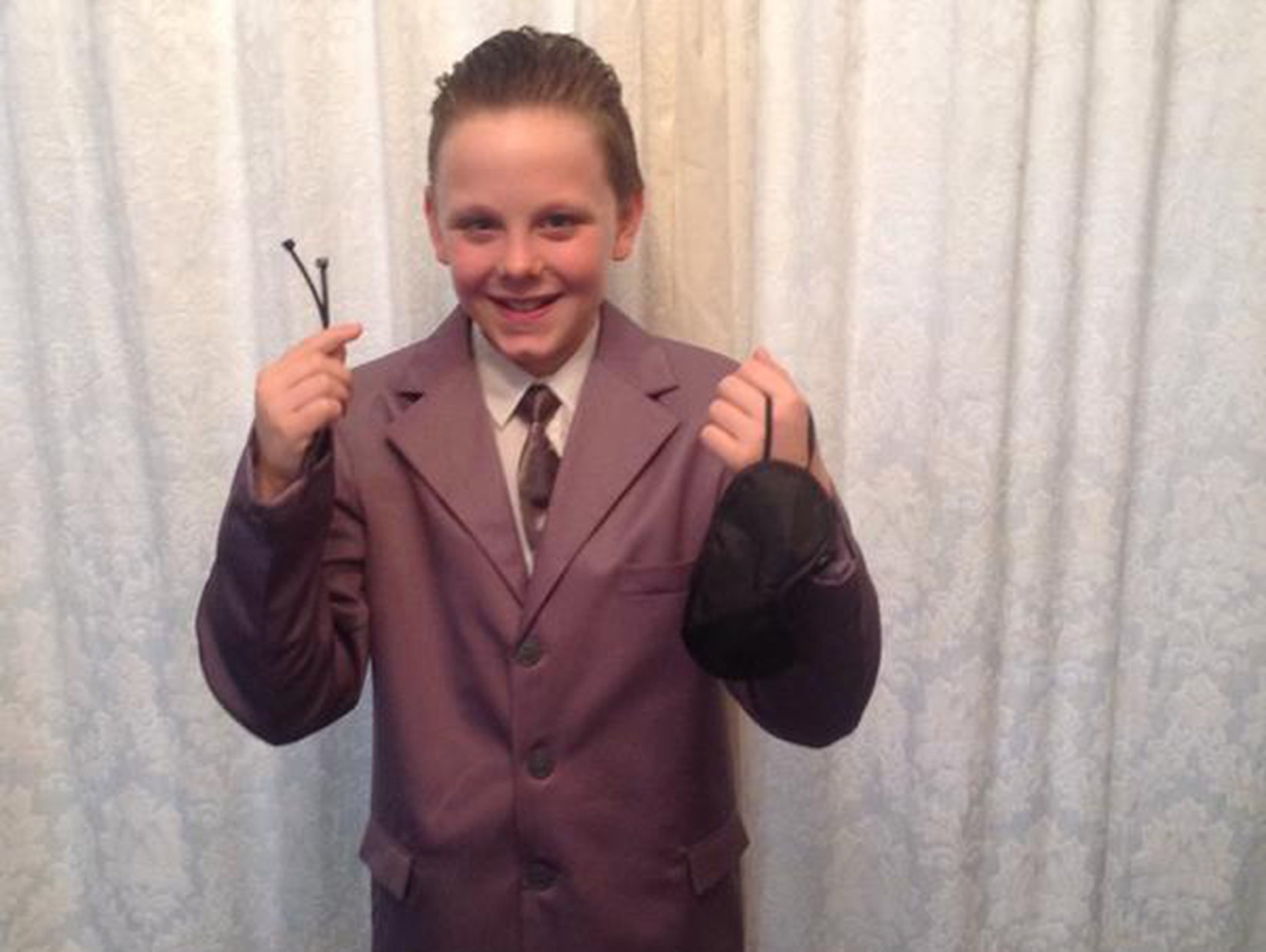 Liam Scholes, 11, dressed as Christian Grey for World Book Day but was told off by his school