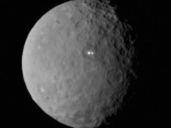 The image taken by Dawn on its approach, on February 19. Nasa still doesn't know where the two bright lights came from