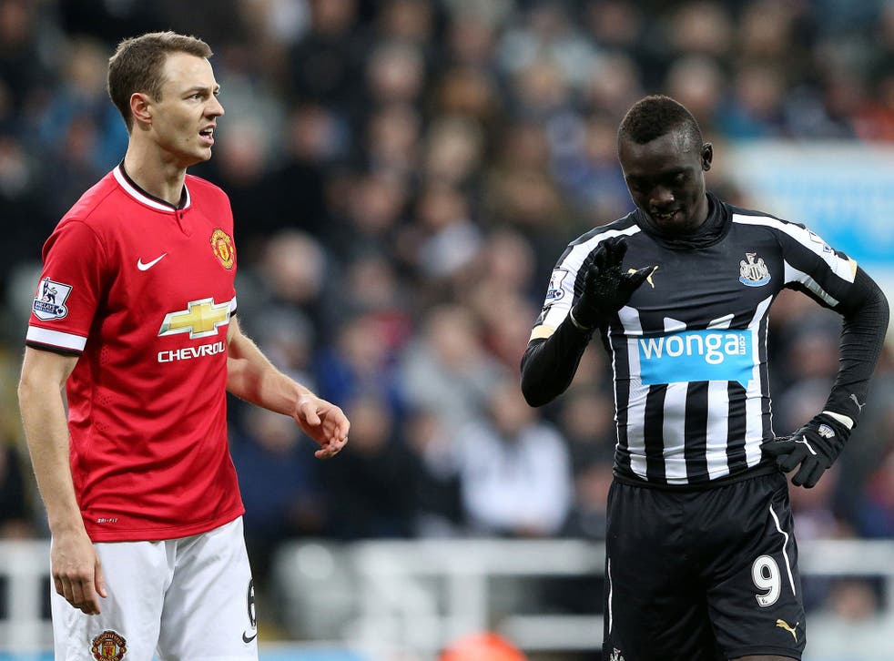 Jonny Evans has pleaded not guilty to an FA charge for spitting at Papiss Cisse
