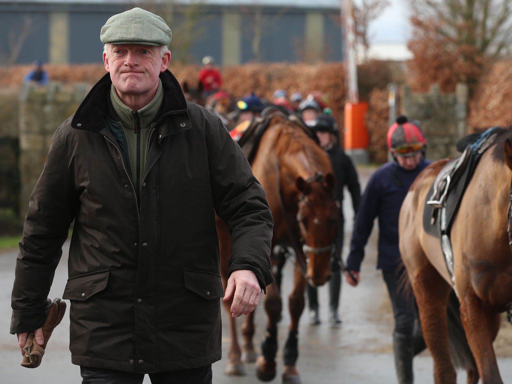 Willie Mullins leads some of his horses out on the gallops at his yard in County Carlow in Ireland