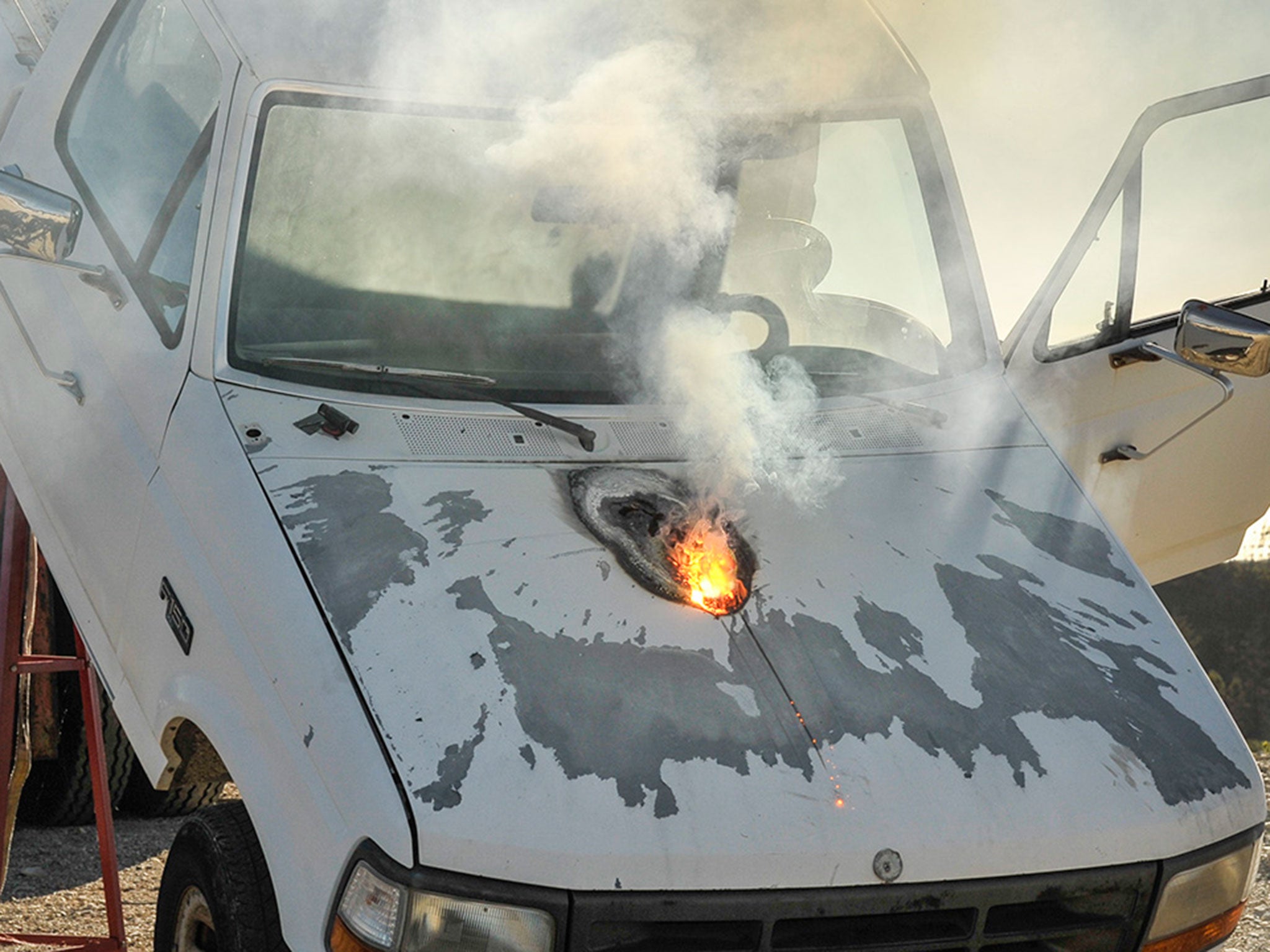 Lockheed Martin ATHENA laser weapon system defeats a truck target by disabling the engine, demonstrating its military effectiveness against enemy ground vehicles.