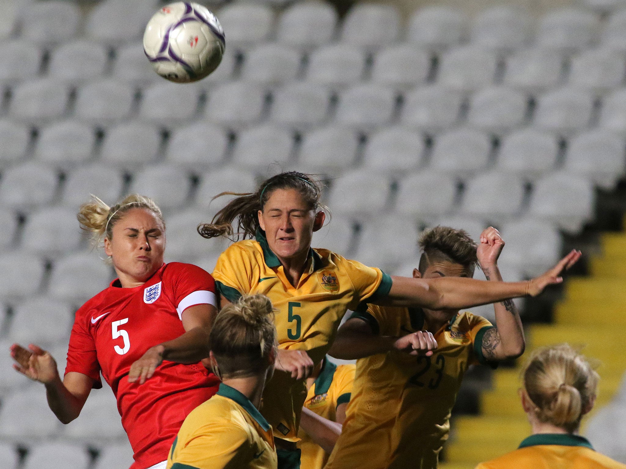 England captain Steph Houghton (left) and Australia's Laura Alleway contest a header