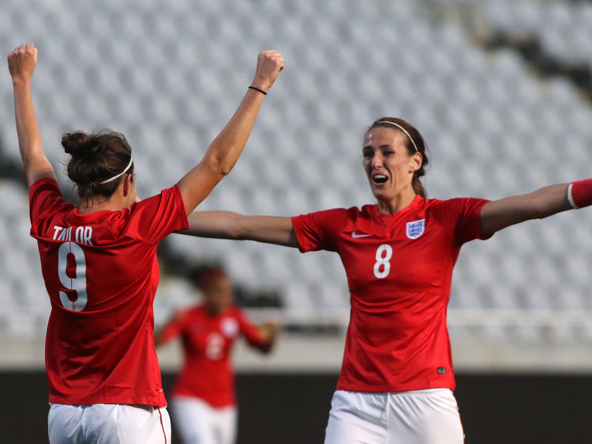 Jodie Taylor (left) celebrates after scoring for England