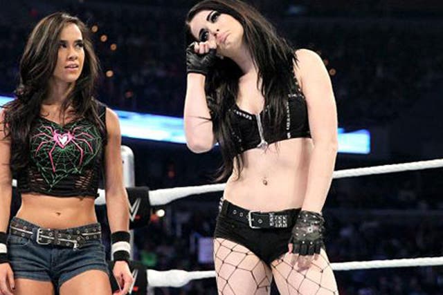 AJ stares at Paige after seeing off Brie Bella
