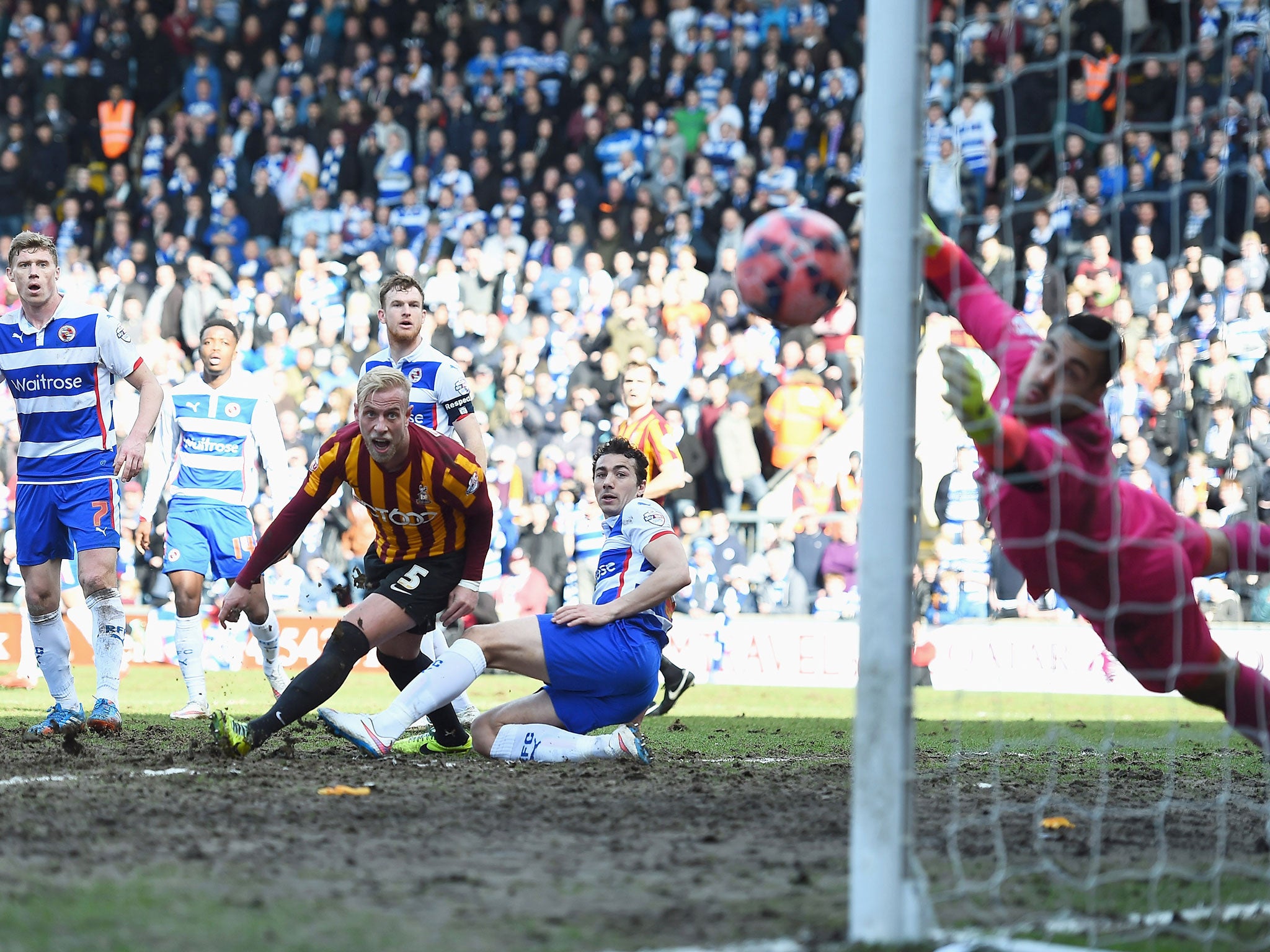 Andrew Davies of Bradford looks on as Gary Liddle's cross hits the post