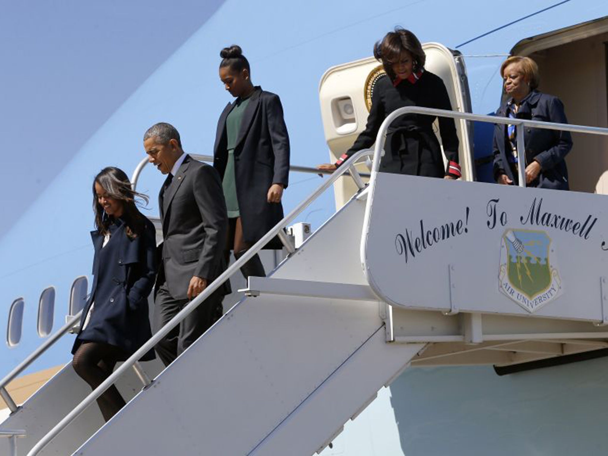 Barack Obama and his daughters arriving in Alabama on Saturday
