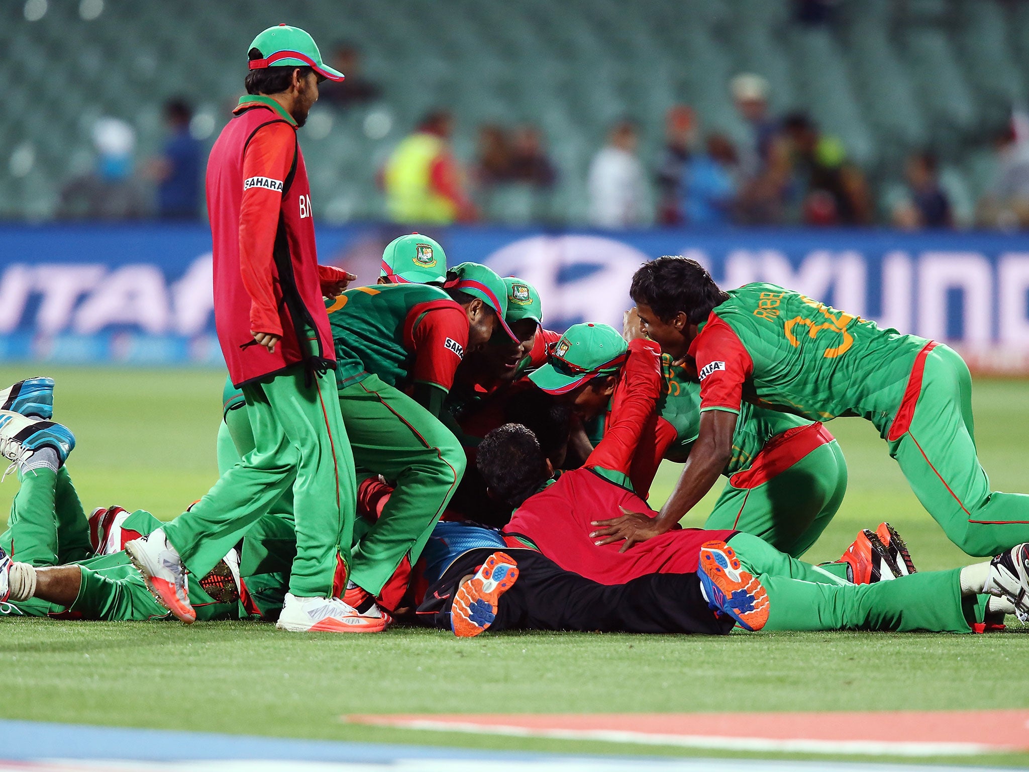 Bangladesh players celebrate after beating England