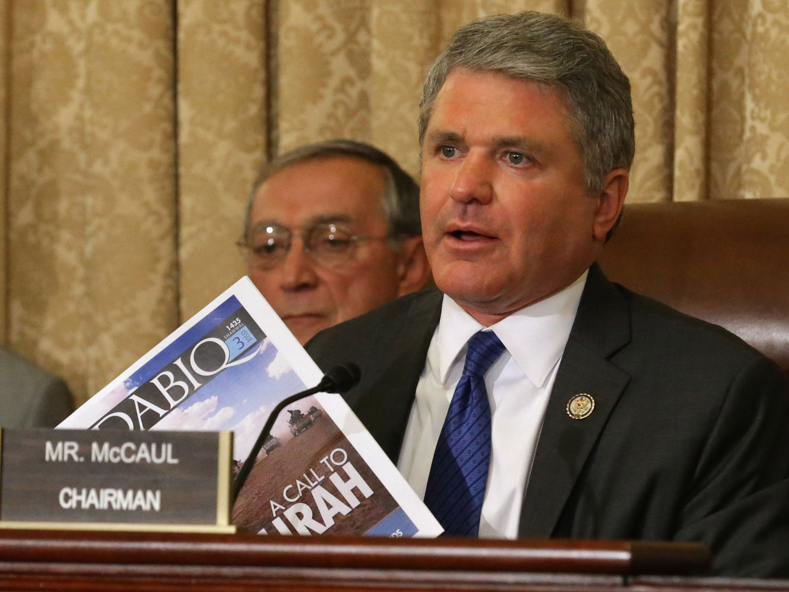 US House Homeland Security Committee Chairman Michael McCaul holds up a copy of Dabiq, the English language magazine published by the Islamic State in Iraq and the Levant, at a terrorism briefing in the US last year.