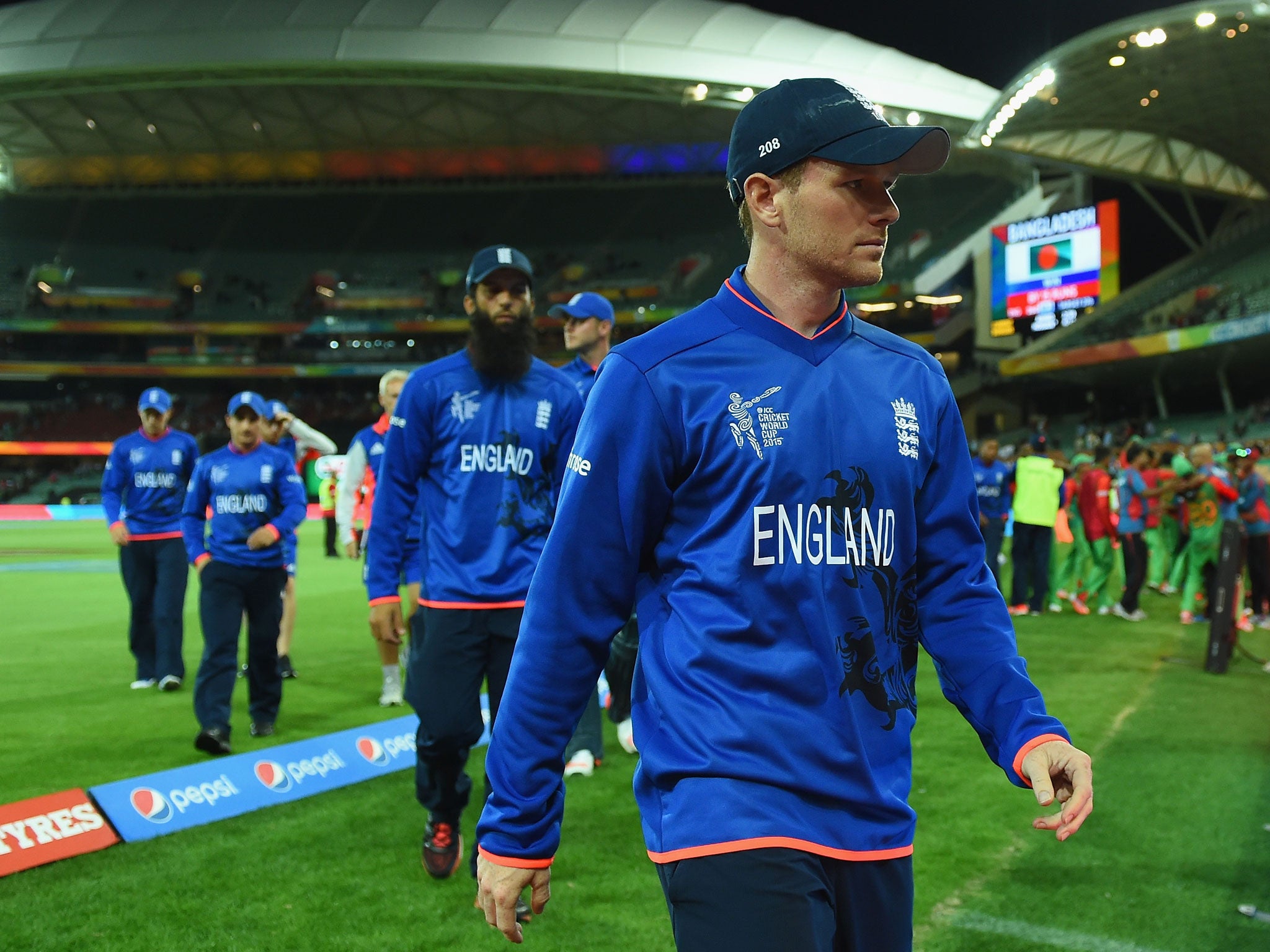 Eoin Morgan leads his side off the pitch after their defeat to Bangladesh