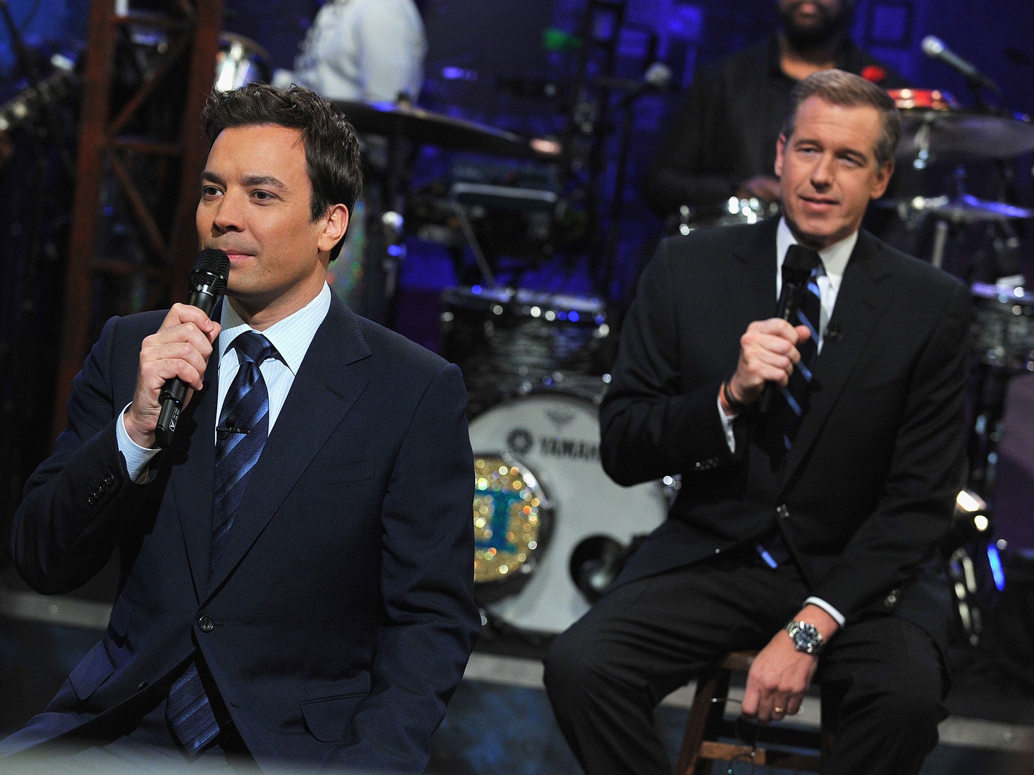 Brian Williams (L) and Jimmy Fallon appear on the Late Night with Jimmy Fallon at the Rockefeller Center on 2 March, 2011, in New York City