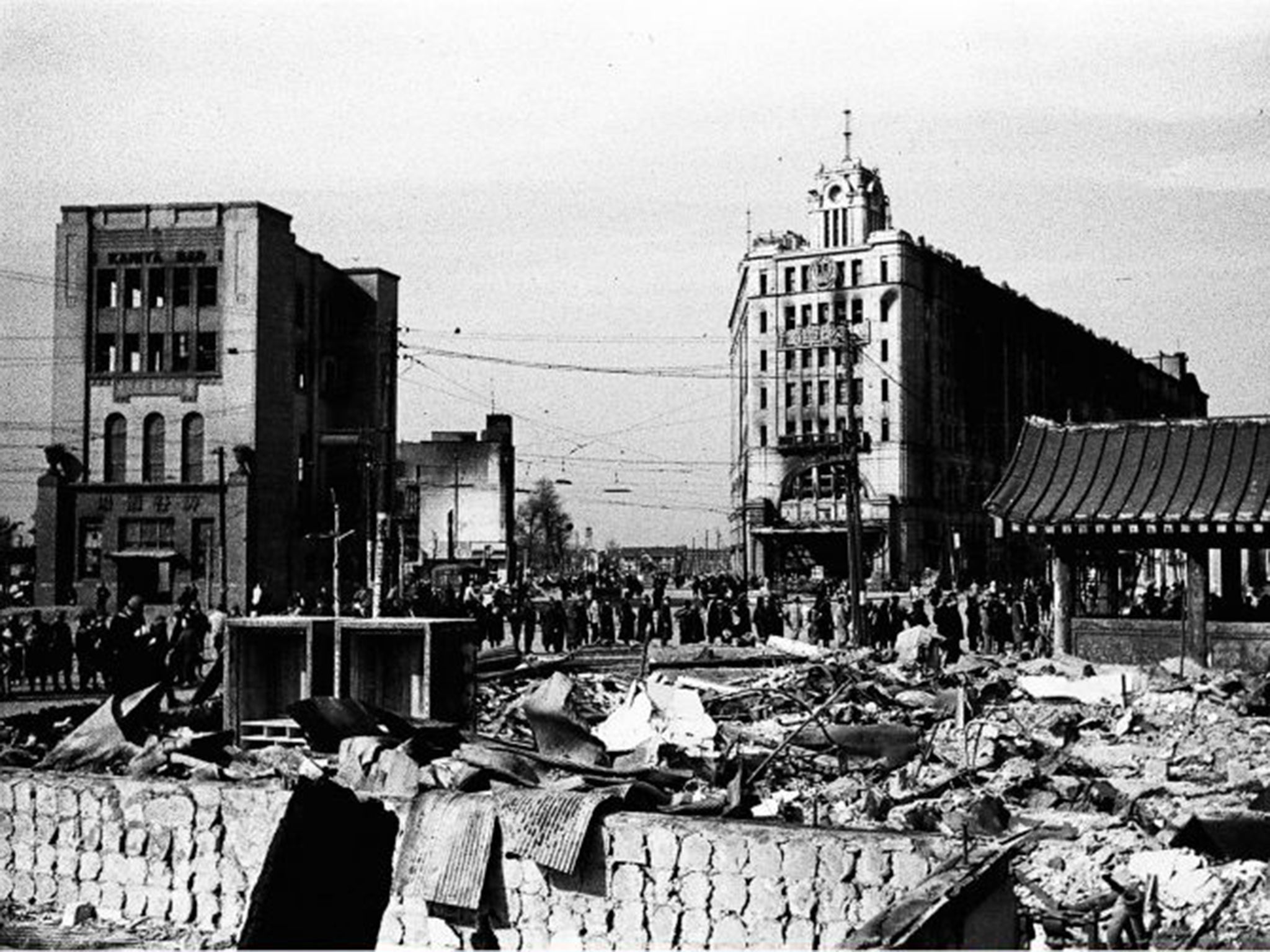 Survivors of the 1945 raids commuting to work through the rubble