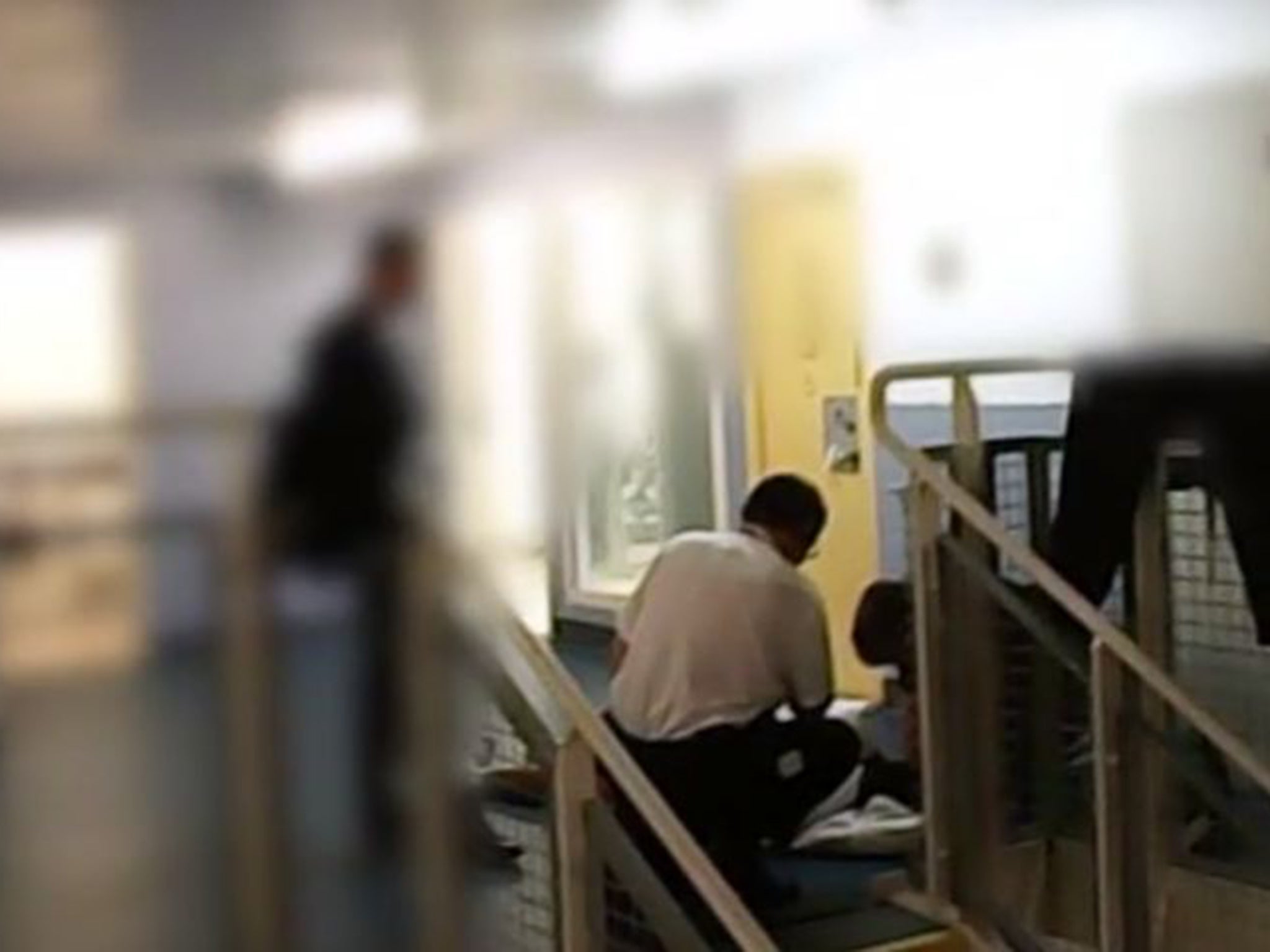 Footage shows a detainee being attended to following an epileptic fit