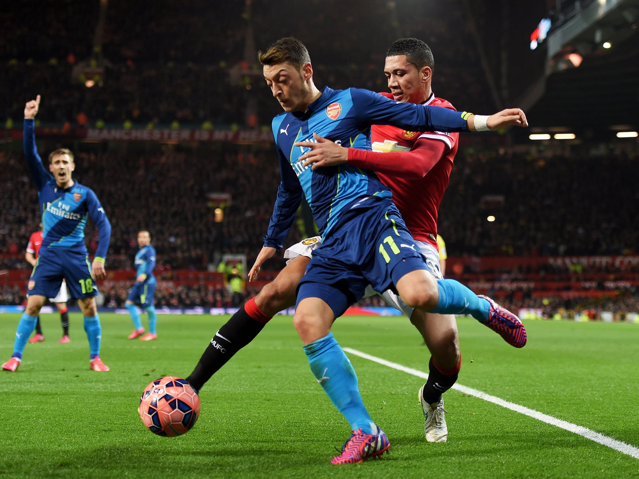 Ozil in action against Manchester United