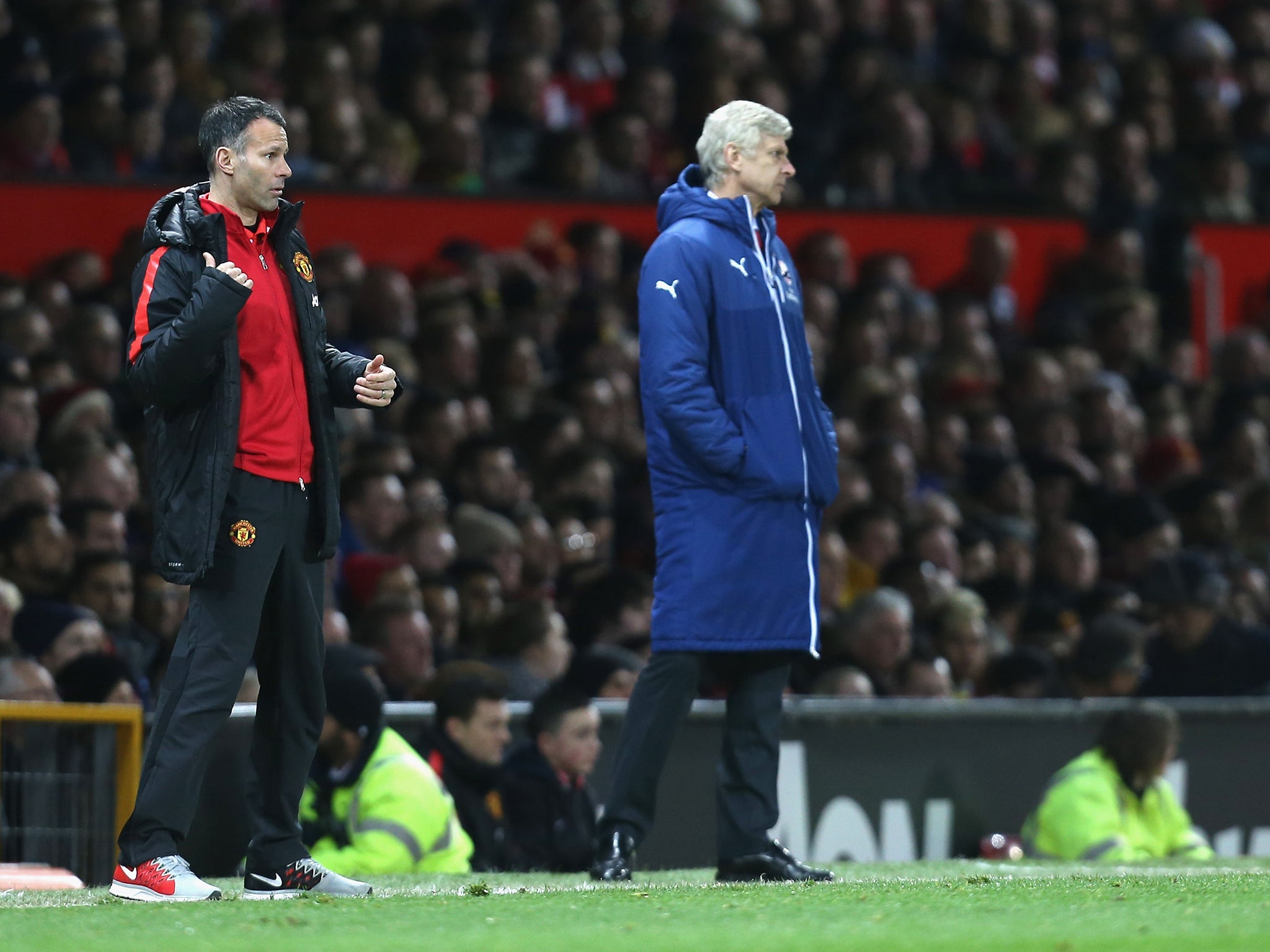 Arsene Wenger and Ryan Giggs on the sidelines