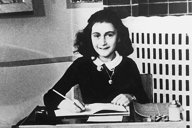 Anne Frank writing in her diary in the 1940s 