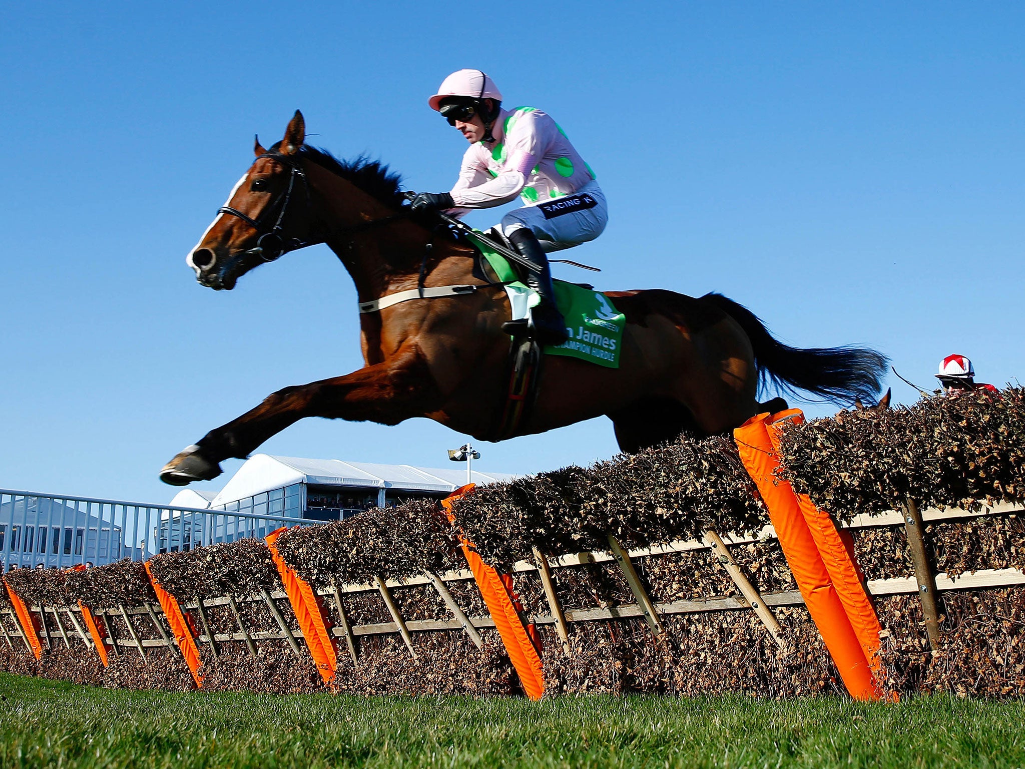 Ruby Walsh on Faugheen jumps the final fence and goes on to win the 15.20 Champion Hurdle Challenge Trophy, in Cheltenham