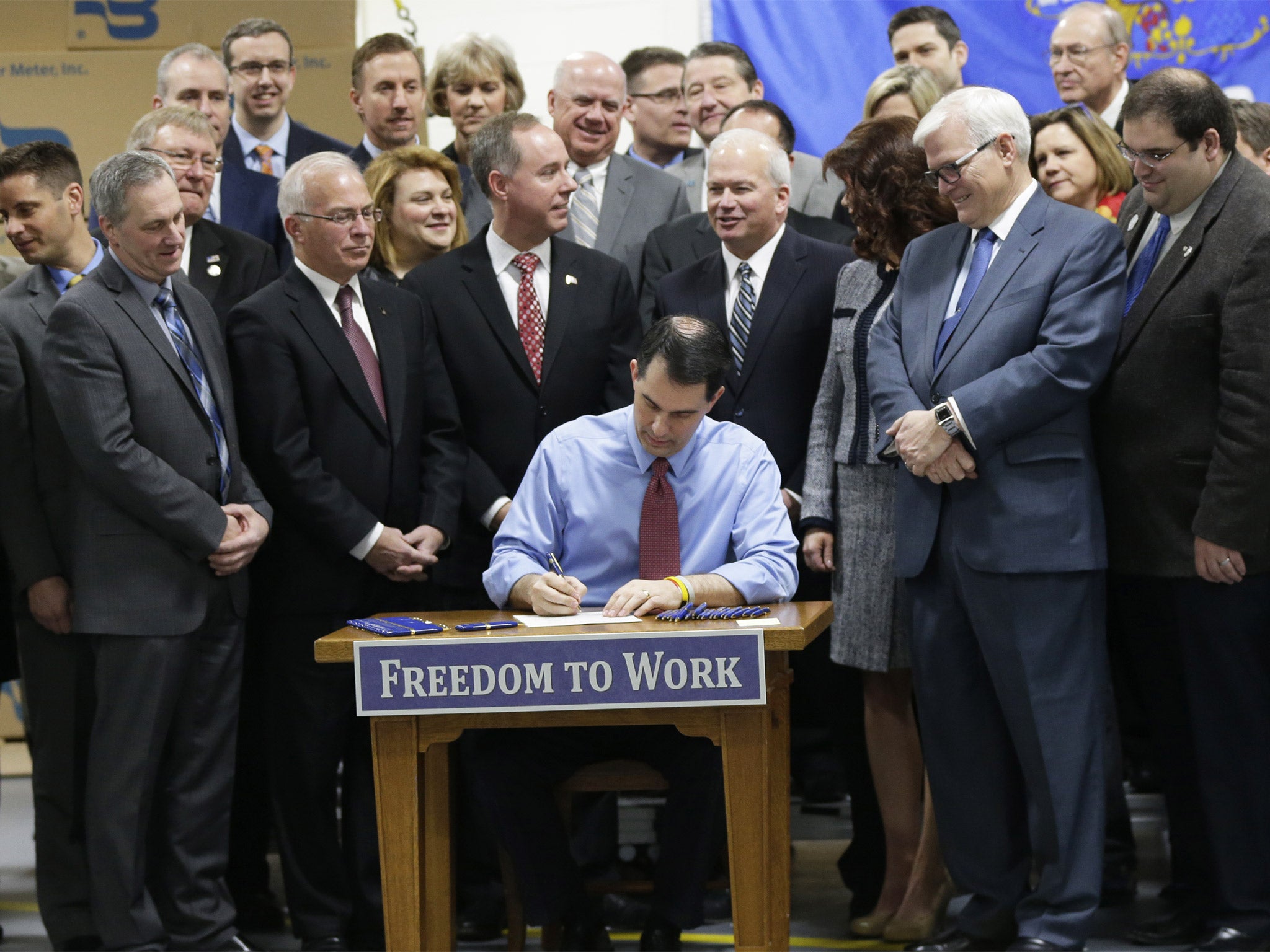 Scott Walker signs the ‘Right to Work’ bill into law