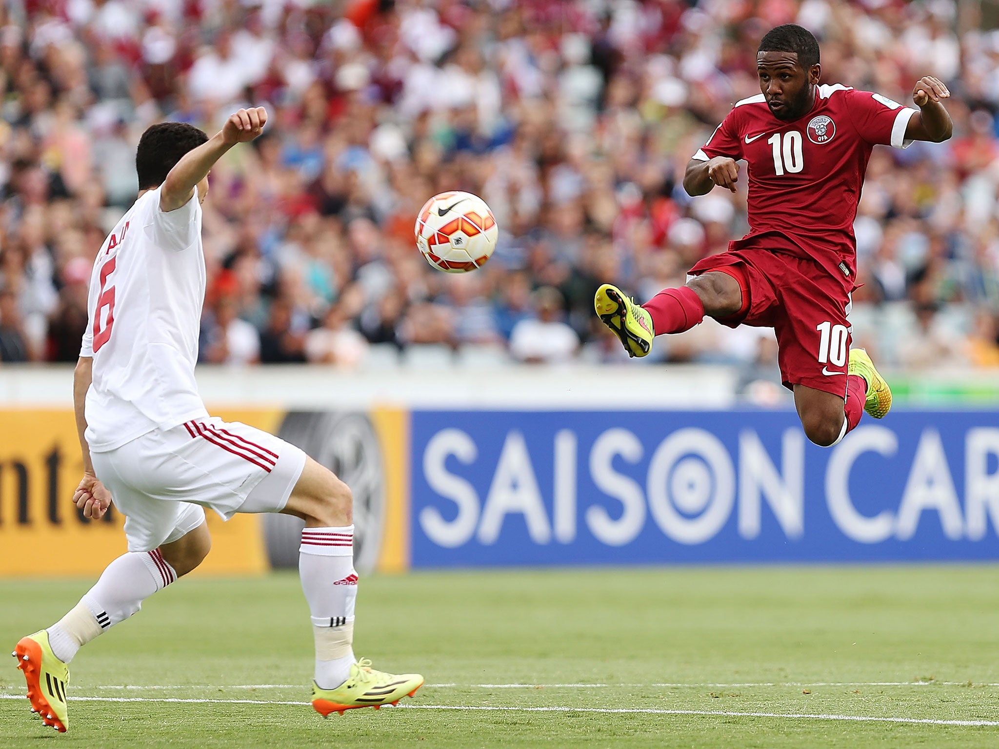 Khalfan Ibrahim of Qatar scores against the UAE