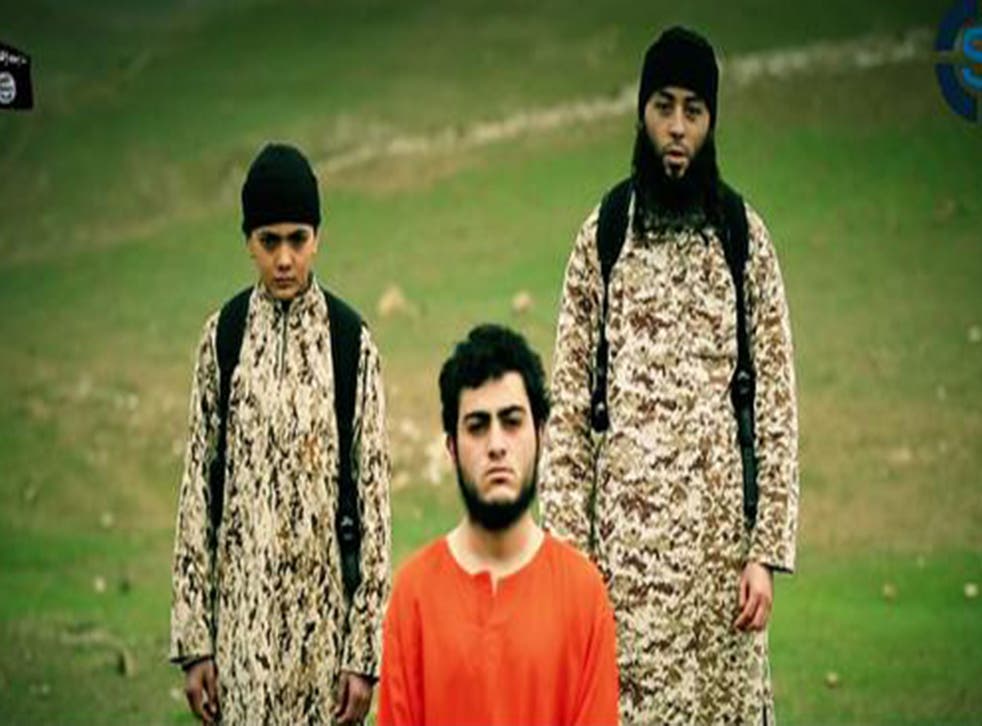 Musallam is pictured between a militant and the child