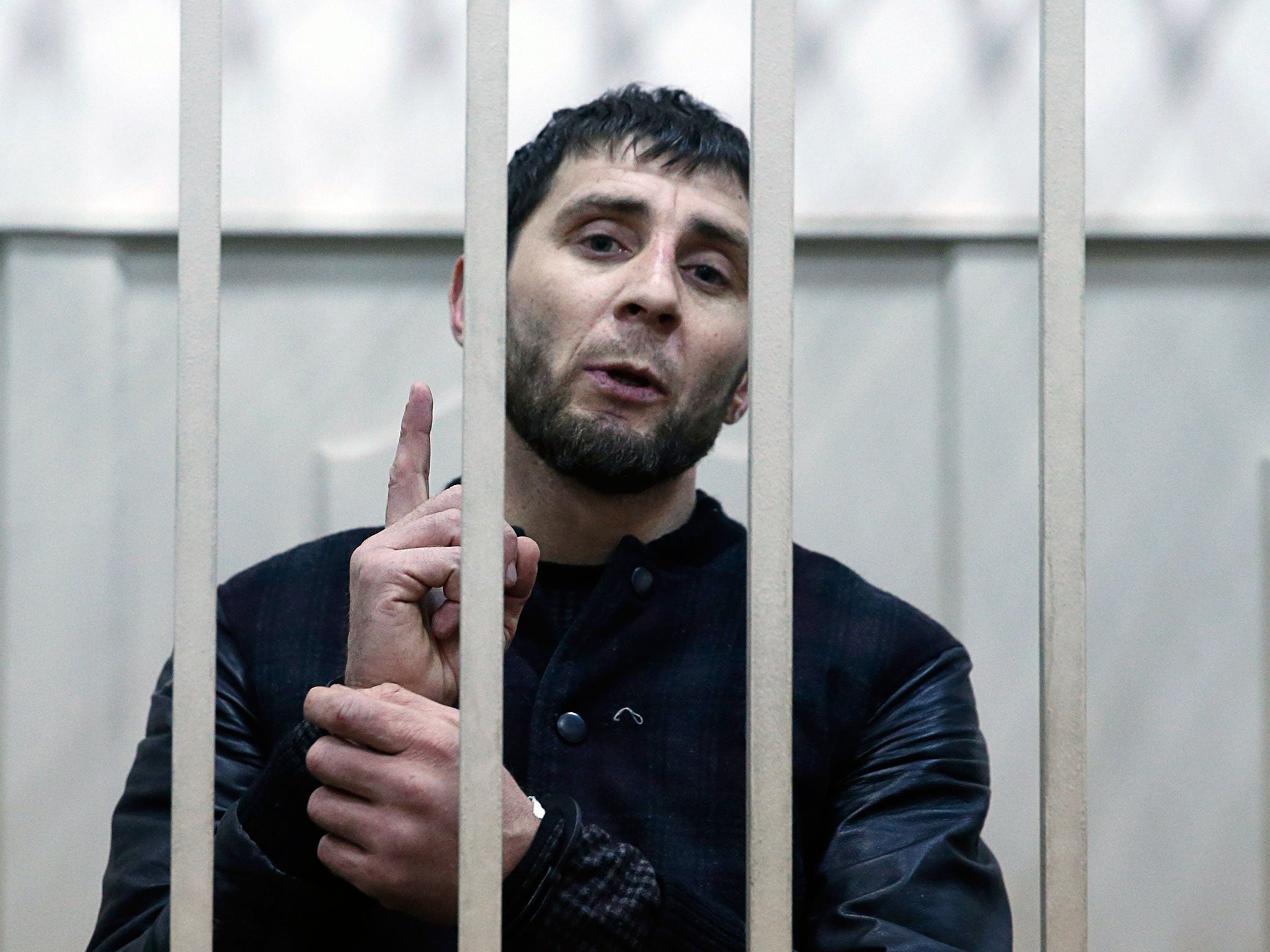 Zaur Dadayev, charged with involvement in the murder of Russian opposition figure Boris Nemtsov, speaks inside a defendants' cage in Moscow