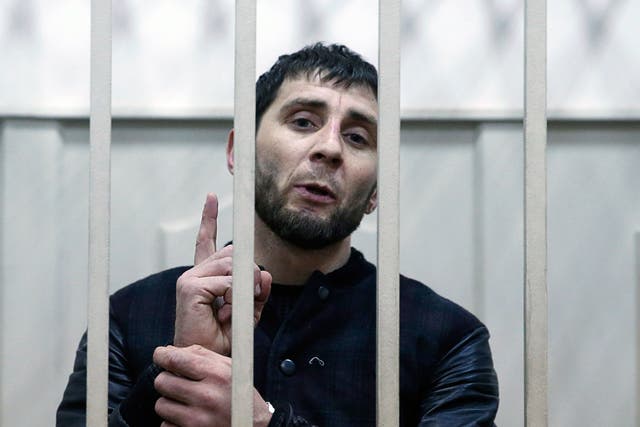 Zaur Dadayev, charged with involvement in the murder of Russian opposition figure Boris Nemtsov, speaks inside a defendants' cage in Moscow