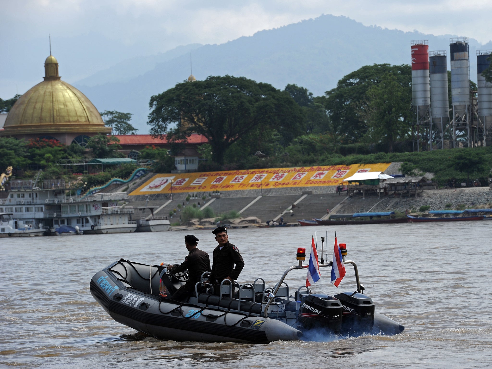Policemen from the Thai Marine Border Police patrol the Mekong river.
