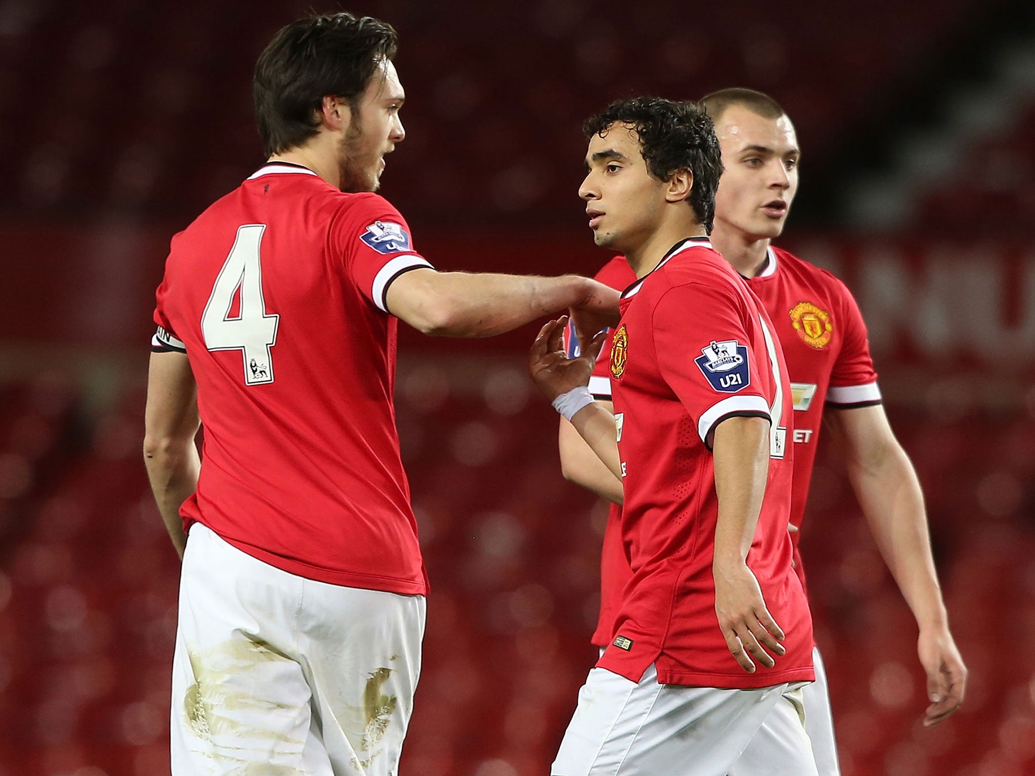 Rafael (centre) celebrates his goal for the Under-21s