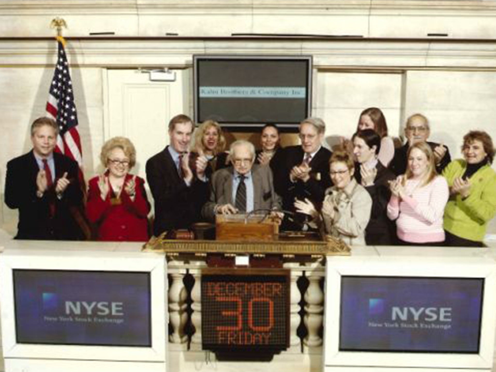 Kahn rings the opening bell on the New York Stock Exchange in 2005 to mark his 100th birthday