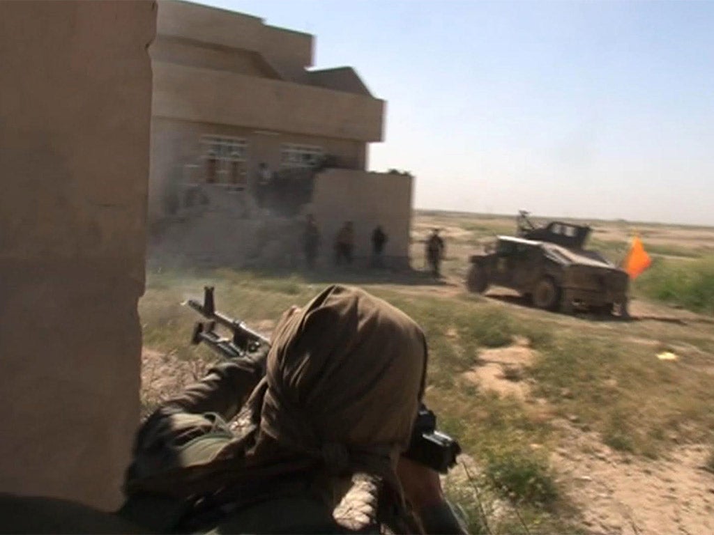 Video footage shows Iraqi fighters taking part in an assault to reclaim Tikrit