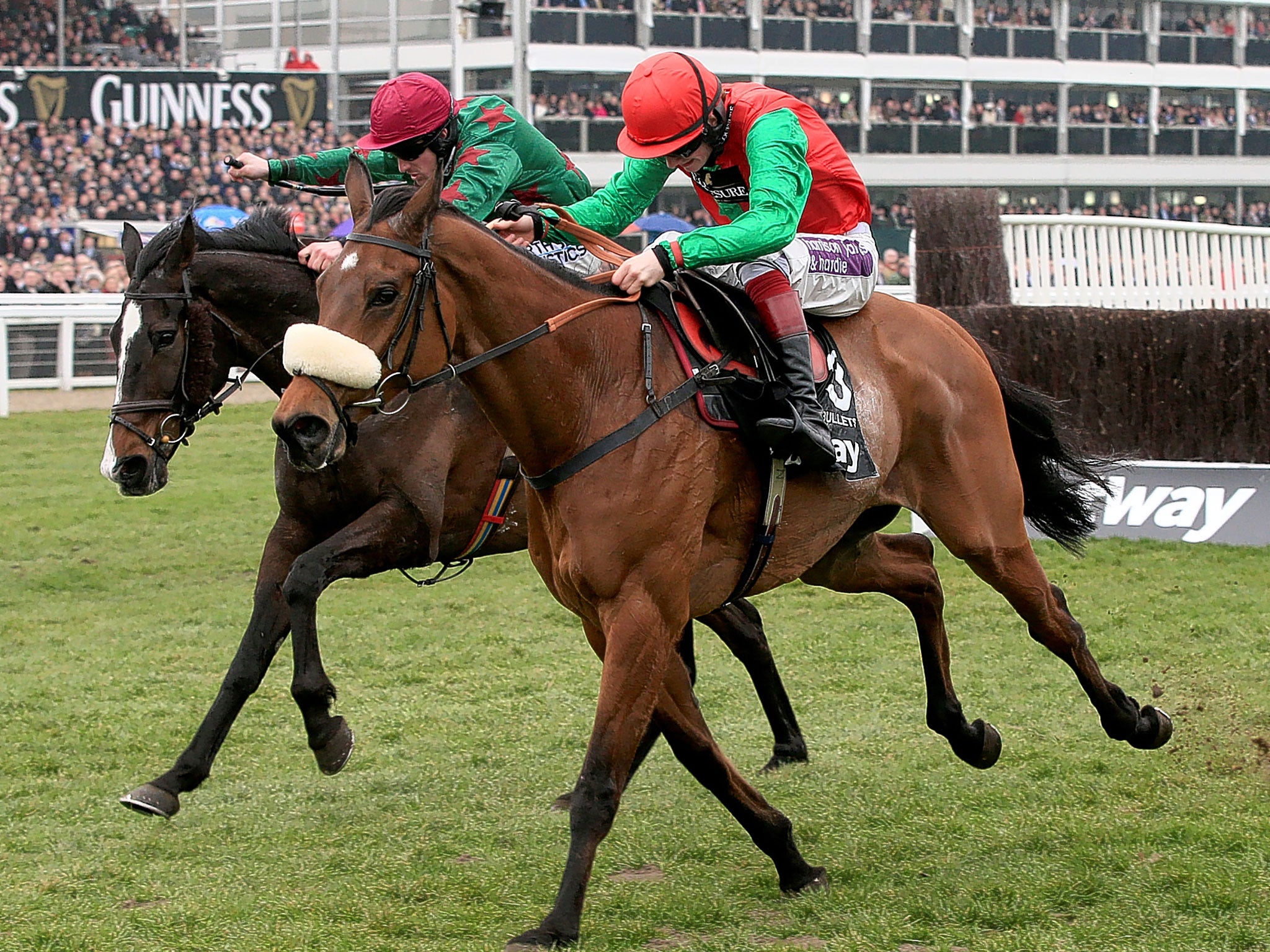 Dodging Bullets ridden by Sam Twiston-Davies (right), holds off the challenge of Somersby to win the Queen Mother Champion Chase