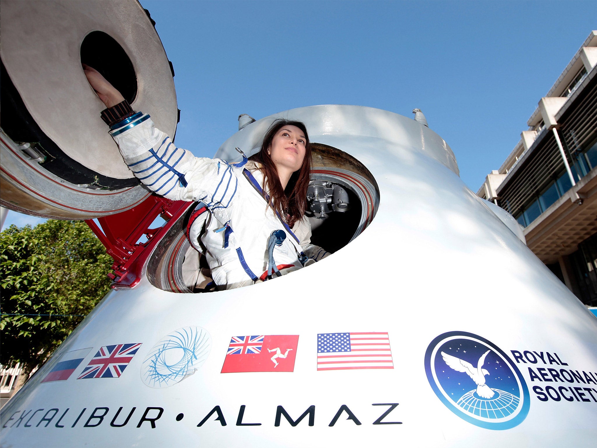 A model poses in the space capsule at the launch of the company in London in 2012