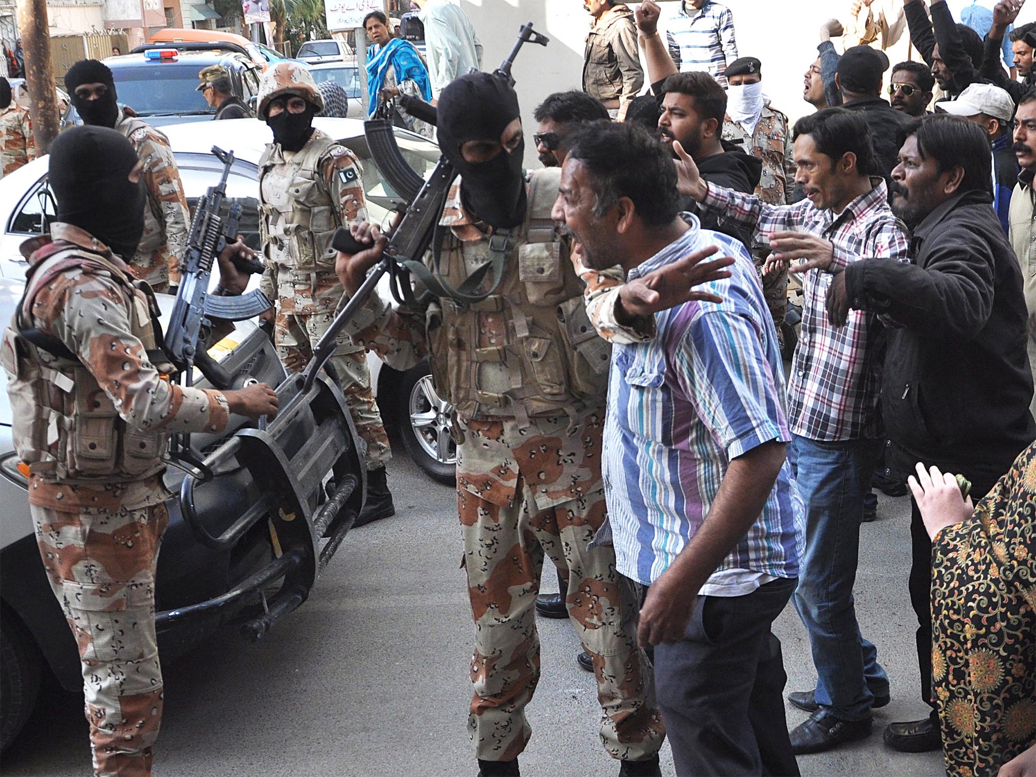 MQM supporters clash with Pakistani Rangers during a protest in Karachi