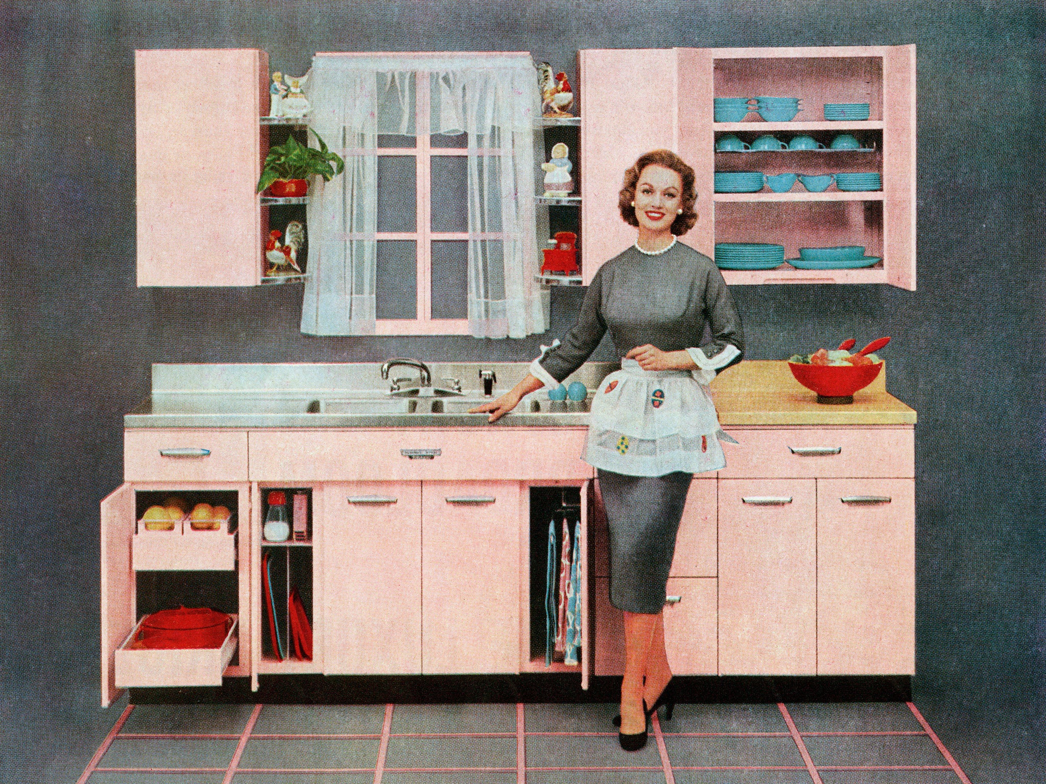 Fashion plate: Vintage illustration of a housewife standing in her new pink kitchen, 1957
