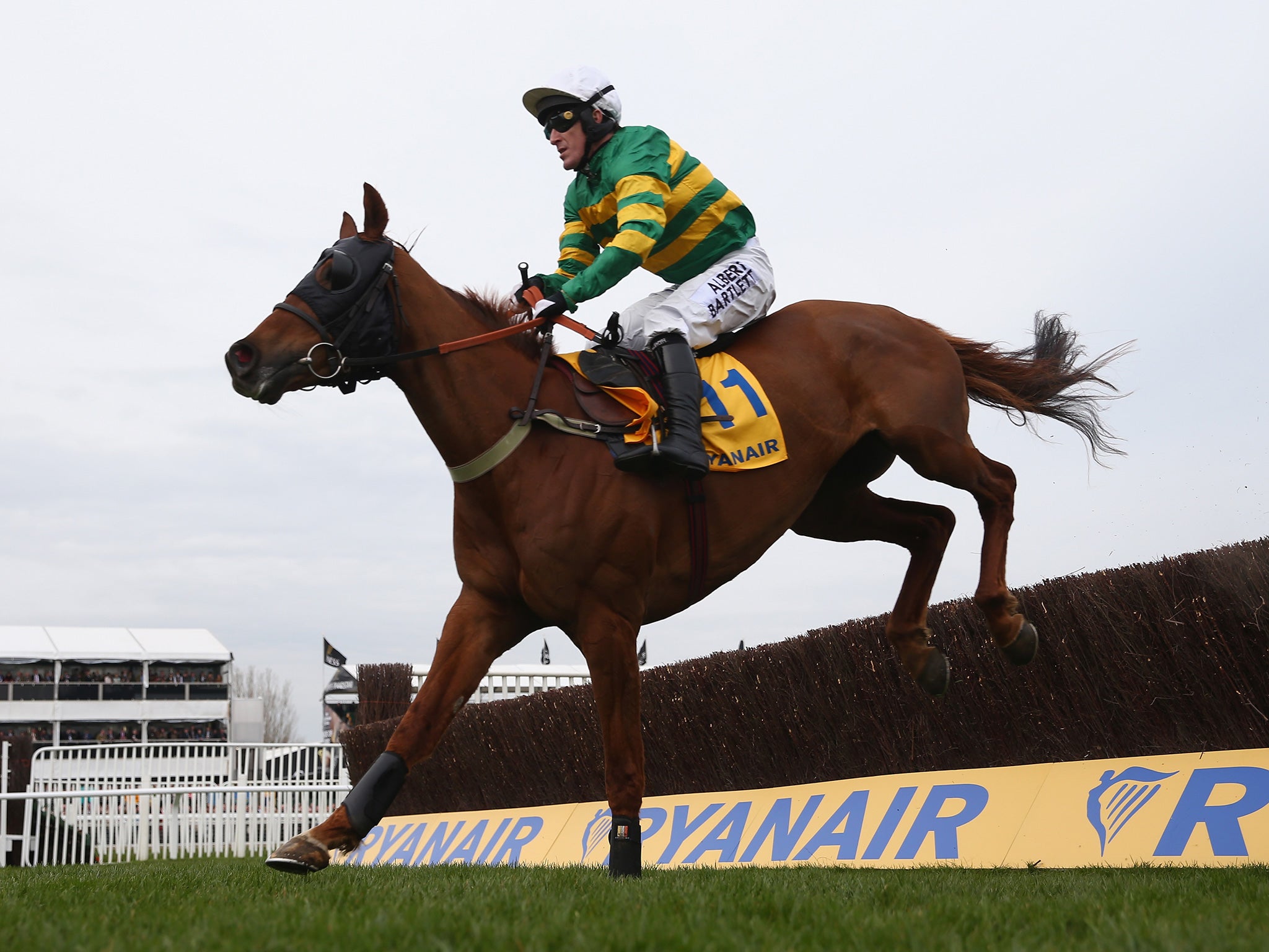 Uxizandre lifts Tony McCoy over the last and on to victory in the Ryanair Chase