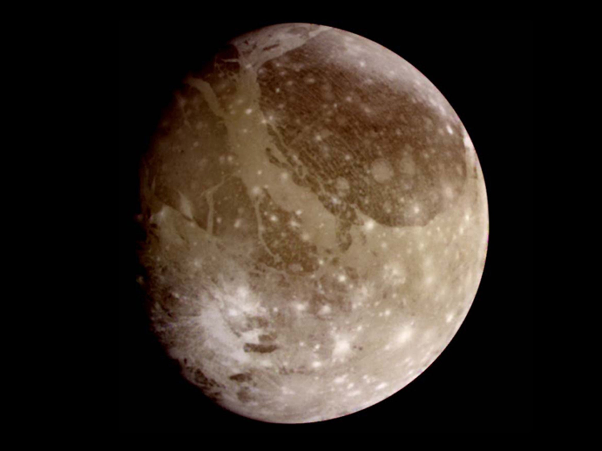 This natural color view of Ganymede was taken from the Galileo spacecraft during its first encounter with the Jovian moon