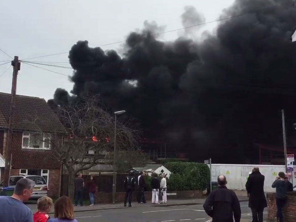 Huge plumes of black smoke and 40 firefighters called to fight fire at St George's school in Weybridge
