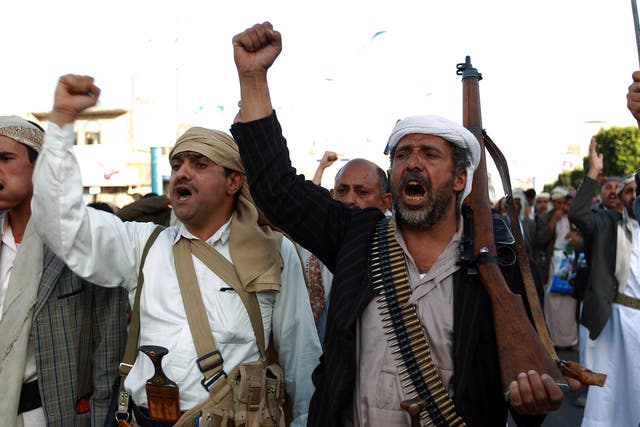 Supporters of the Shiite Houthi movement shout slogans during a rally against US and Saudi intervention in Yemen