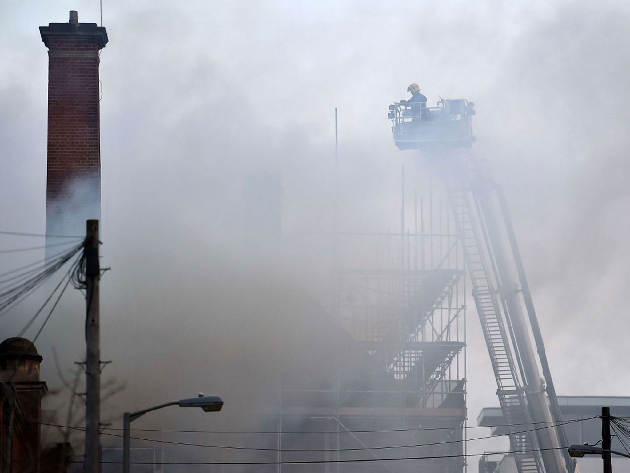 Firefighters tackle a fire at the Battersea Arts Centre. (AFP)