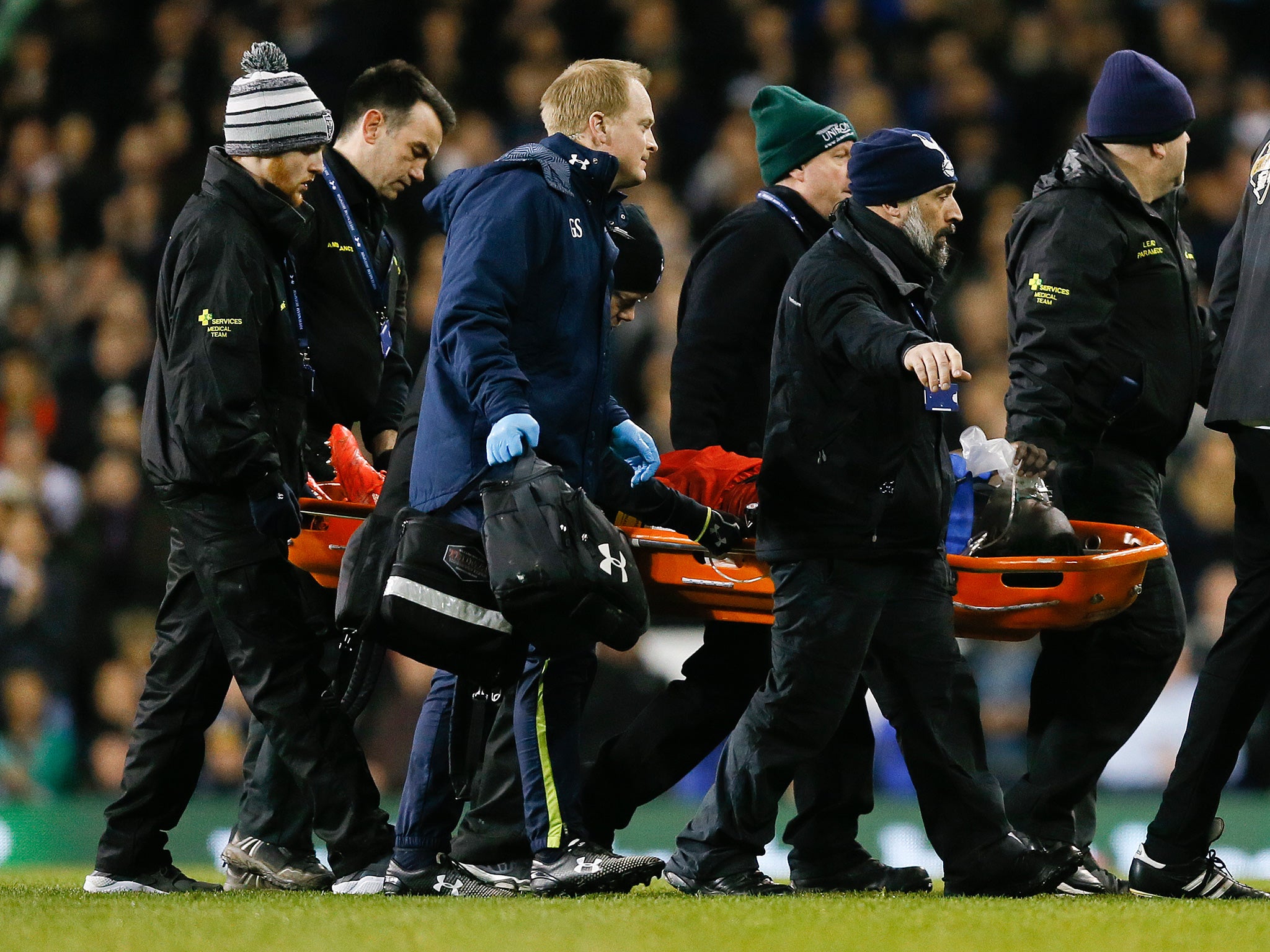 Bafetimbi Gomis is carried off at White Hart Lane after a fainting episode which cause much alarm at the time