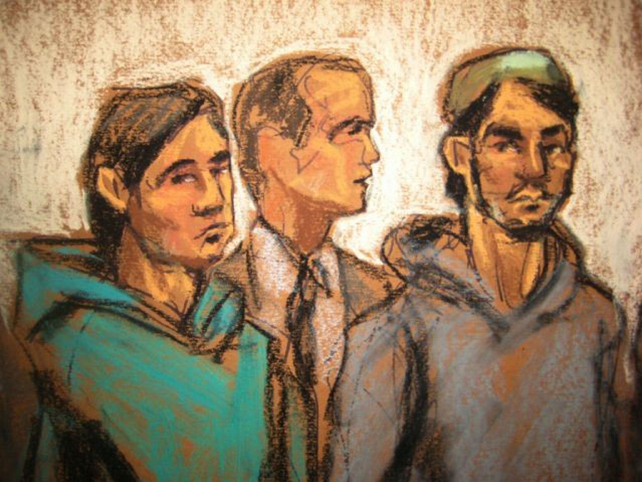 Defendant Akhror Saidakmetov, left; an interpreter, center; and defendant Abdurasul Hasanovich Juraboev, appear at federal court in New York on terrorism charges in February