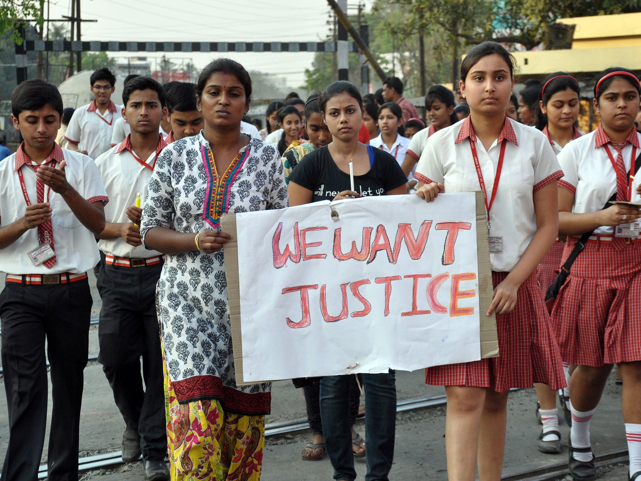 Students of Convent of Jesus and Mary School participate in a protest against the alleged gang rape of a nun in her 70s