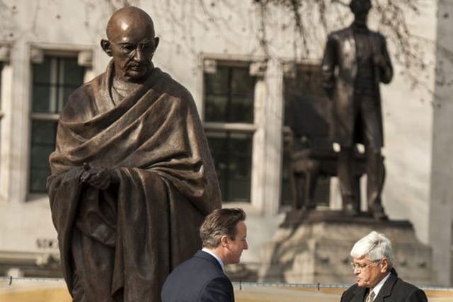 New statue of Gandhi unveiled in Parliament Square. Prime Minister David Cameron shakes hands with Mahatma Gandhi's grandson, Shri Gopalkrishna Gandhi